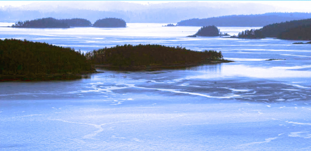 Aerial image of Pender Islands in the Salish Sea. Blue sky on a sunny day.